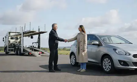 Vehicle owner beside their delivered car in Renfrewshire, United Kingdom