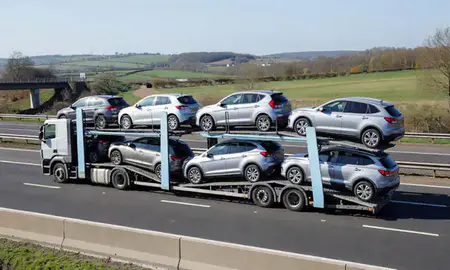 Multi-level car carrier on the motorway to Telford, Shropshire, United Kingdom