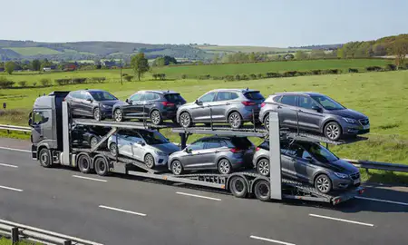 Multi-level car carrier on the motorway to Somerset, United Kingdom