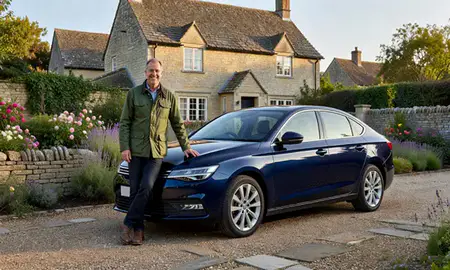Customer with their delivered car in Somerset, United Kingdom