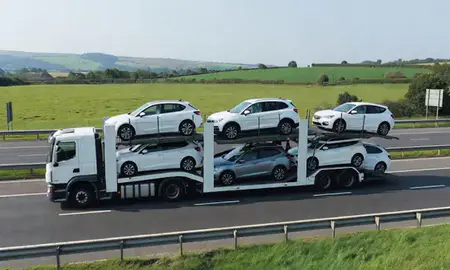 Multi-level car carrier on the motorway to Bath, Somerset, United Kingdom
