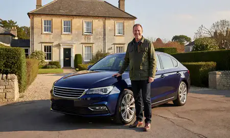 Customer with their delivered car in Bath, Somerset, United Kingdom