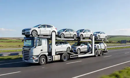 Multi-level car carrier on the motorway to Taunton, Somerset, United Kingdom