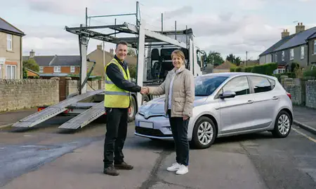 Vehicle owner beside their delivered car in Taunton, Somerset, United Kingdom