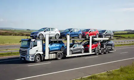 Multi-level car carrier on the motorway to Weston-super-Mare, Somerset, United Kingdom
