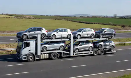 Multi-level car carrier on the motorway to Yeovil, Somerset, United Kingdom