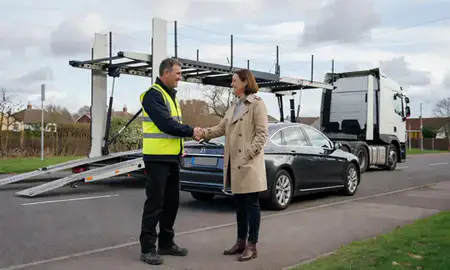 Vehicle owner beside their delivered car in Yeovil, Somerset, United Kingdom