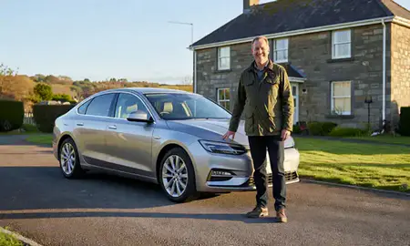 Customer with their delivered car in South Ayrshire, United Kingdom