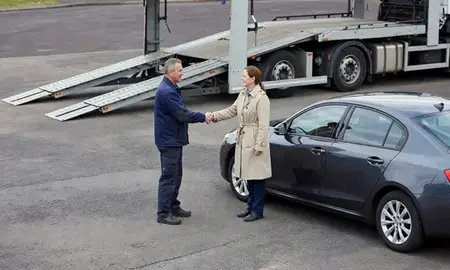 Vehicle owner beside their delivered car in Ayr, South Ayrshire, United Kingdom
