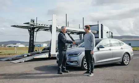 Vehicle owner beside their delivered car in South Glamorgan, United Kingdom