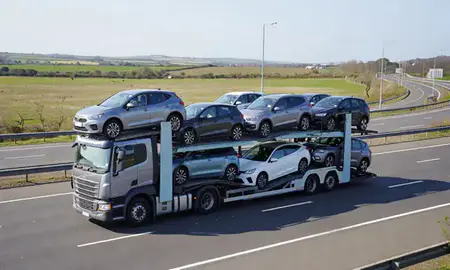 Multi-level car carrier on the motorway to Barry, South Glamorgan, United Kingdom