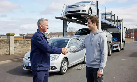 Vehicle owner beside their delivered car in Cardiff, South Glamorgan, United Kingdom