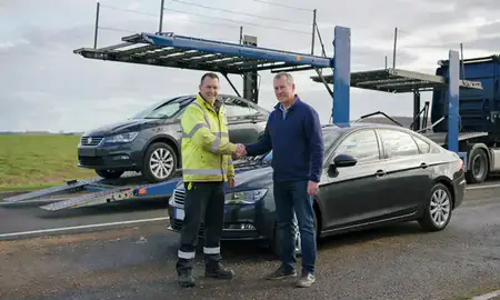 Vehicle owner beside their delivered car in South Lanarkshire, United Kingdom