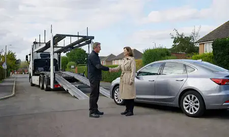 Vehicle owner beside their delivered car in East Kilbride, South Lanarkshire, United Kingdom