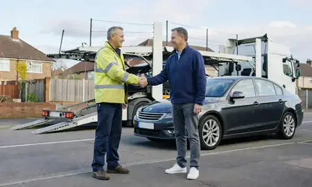 Vehicle owner beside their delivered car in Hamilton, South Lanarkshire, United Kingdom