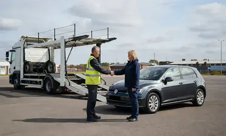 Vehicle owner beside their delivered car in Barnsley, South Yorkshire, United Kingdom