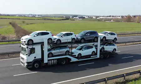 Multi-level car carrier on the motorway to Wath-upon-Dearne, South Yorkshire, United Kingdom