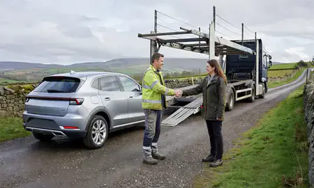 Vehicle owner beside their delivered car in Staffordshire, United Kingdom