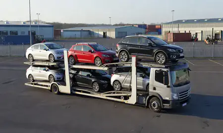 Car transporter loaded with vehicles in Newcastle-under-Lyme, Staffordshire, United Kingdom