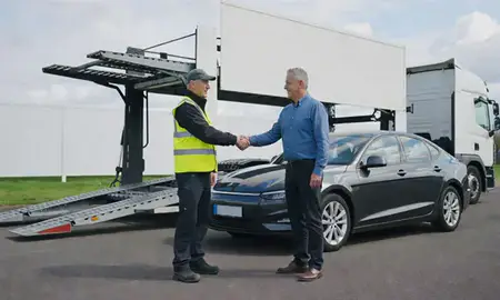 Vehicle owner beside their delivered car in Tamworth, Staffordshire, United Kingdom
