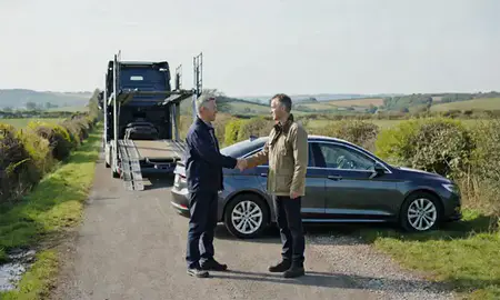 Vehicle owner beside their delivered car in Suffolk, United Kingdom