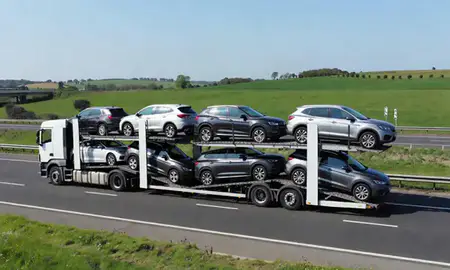 Multi-level car carrier on the motorway to Ipswich, Suffolk, United Kingdom