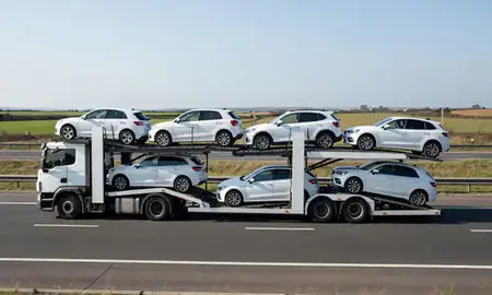Multi-level car carrier on the motorway to Lowestoft, Suffolk, United Kingdom