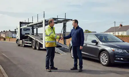 Vehicle owner beside their delivered car in Lowestoft, Suffolk, United Kingdom