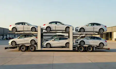Car transporter parked in an industrial area of Esher, Surrey, United Kingdom