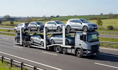 Multi-level car carrier on the motorway to Ewell, Surrey, United Kingdom