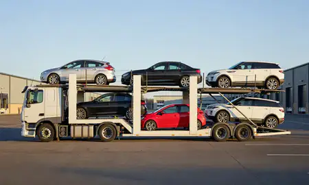 Car transporter parked in an industrial area of Ewell, Surrey, United Kingdom