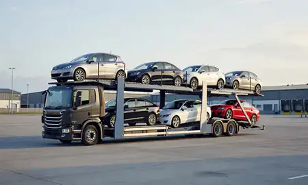 Car transporter loaded with vehicles in Ewell, Surrey, United Kingdom