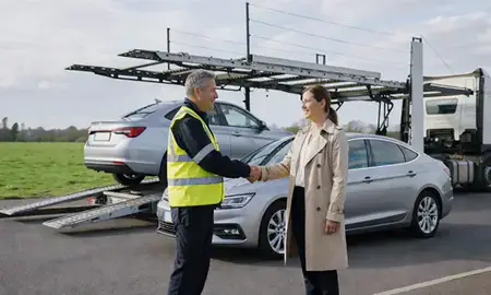 Vehicle owner beside their delivered car in Walton-on-Thames, Surrey, United Kingdom