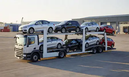 Car transporter loaded with vehicles in Woking, Surrey, United Kingdom