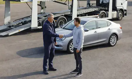Vehicle owner beside their delivered car in Tyne and Wear, United Kingdom