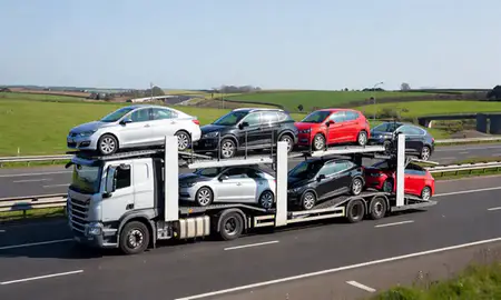 Multi-level car carrier on the motorway to Gateshead, Tyne and Wear, United Kingdom