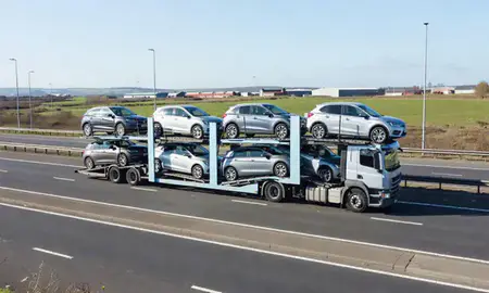Multi-level car carrier on the motorway to Longbenton, Tyne and Wear, United Kingdom