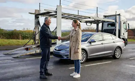 Vehicle owner beside their delivered car in Newcastle upon Tyne, Tyne and Wear, United Kingdom