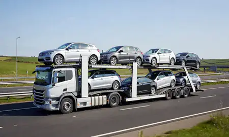 Multi-level car carrier on the motorway to South Shields, Tyne and Wear, United Kingdom