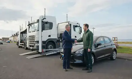Vehicle owner beside their delivered car in South Shields, Tyne and Wear, United Kingdom