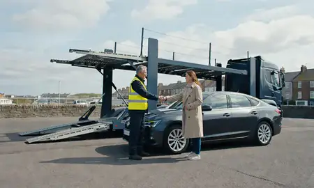 Vehicle owner beside their delivered car in Tynemouth, Tyne and Wear, United Kingdom
