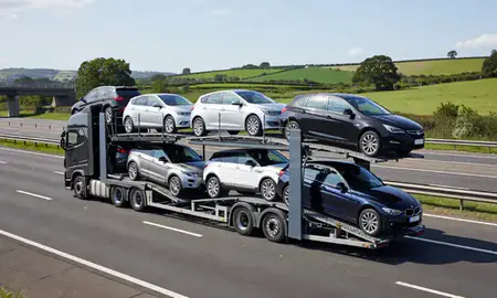 Multi-level car carrier on the motorway to Royal Leamington Spa, Warwickshire, United Kingdom