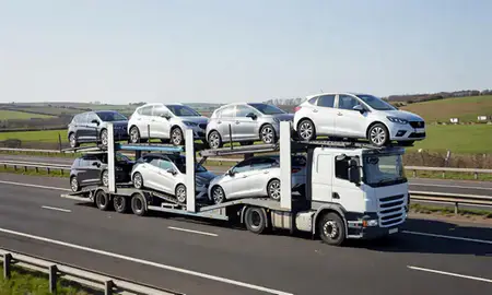 Multi-level car carrier on the motorway to Rugby, Warwickshire, United Kingdom