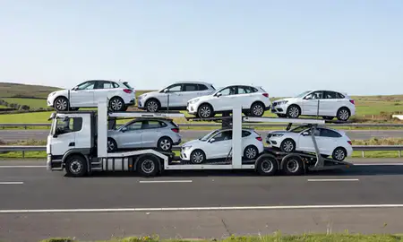 Multi-level car carrier on the motorway to Neath, West Glamorgan, United Kingdom