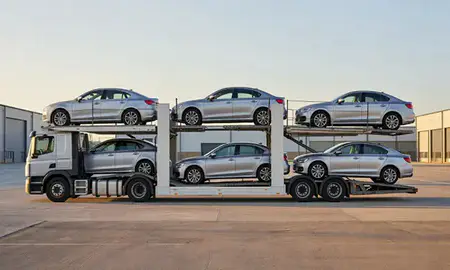 Car transporter parked in an industrial area of West Lothian, United Kingdom