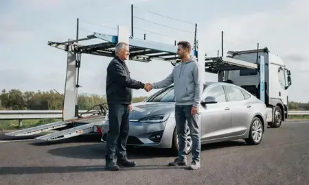Vehicle owner beside their delivered car in Aldridge, West Midlands, United Kingdom