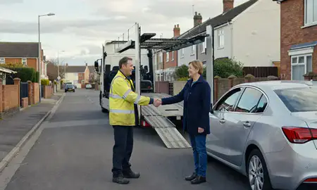 Vehicle owner beside their delivered car in Bloxwich, West Midlands, United Kingdom