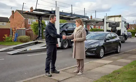 Vehicle owner beside their delivered car in Coventry, West Midlands, United Kingdom