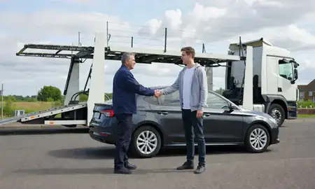 Vehicle owner beside their delivered car in Kingswinford, West Midlands, United Kingdom