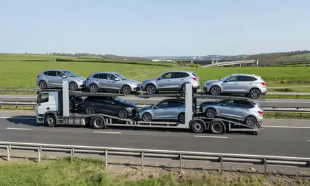 Multi-level car carrier on the motorway to Tipton, West Midlands, United Kingdom